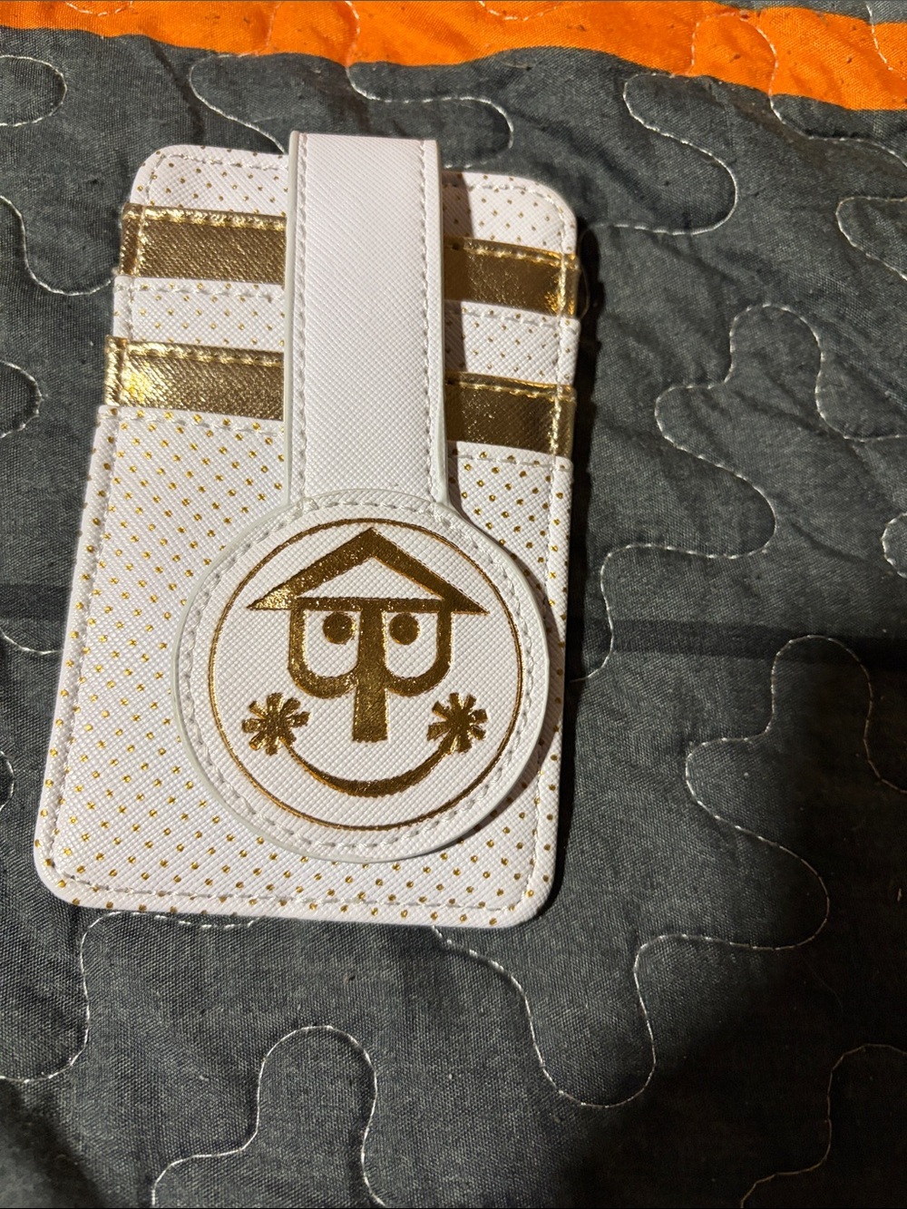 Disney White and Gold Card Holder with Smiley Motif it’s a small world